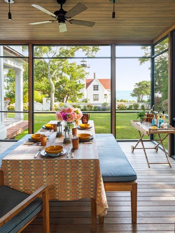 a table and home bar by desigher markham roberts in martha's vineyard