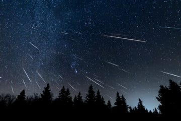 meteor shower composite created from 44 individual photos that includes the milky way