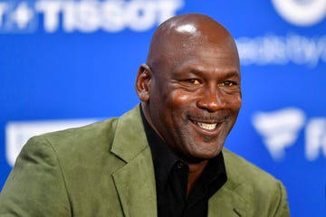 michael jordan smiling while talking to reporters