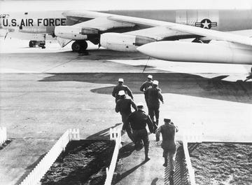 usa, militaery, usaf, strategic air command sac a boeing b 52 g 'stratofortress' long distance bomberat an air force base crew scramble about 1960