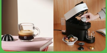 a coffee maker with a glass of liquid and a cup of coffee