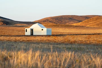 a white building in a field