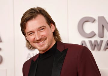 morgan wallen smiling for a photo at an awards event