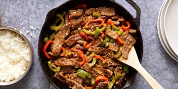 steak with sliced red and green peppers