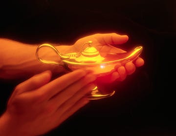 person rubbing magic lamp to conjure genie