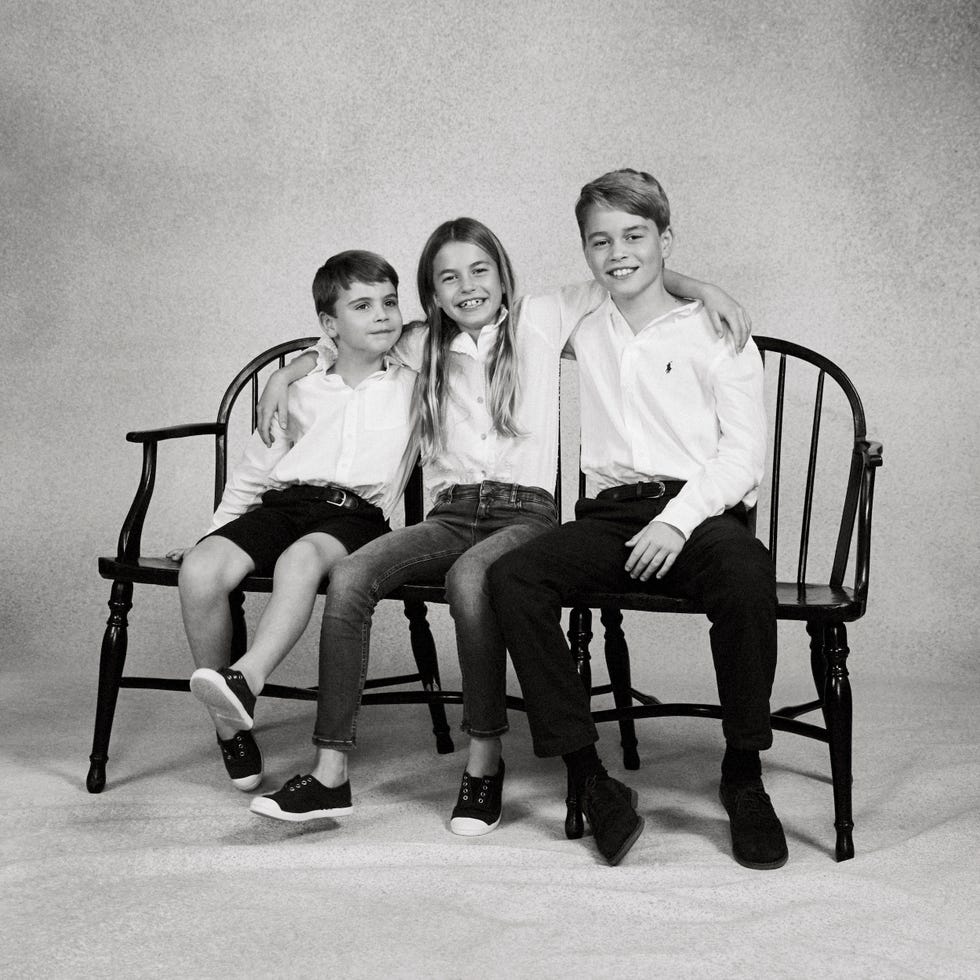 a group of people sitting on chairs