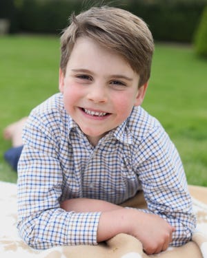 a boy smiling at the camera