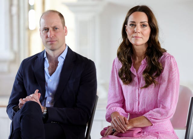 prince william and kate middleton sitting down while visiting jamaica