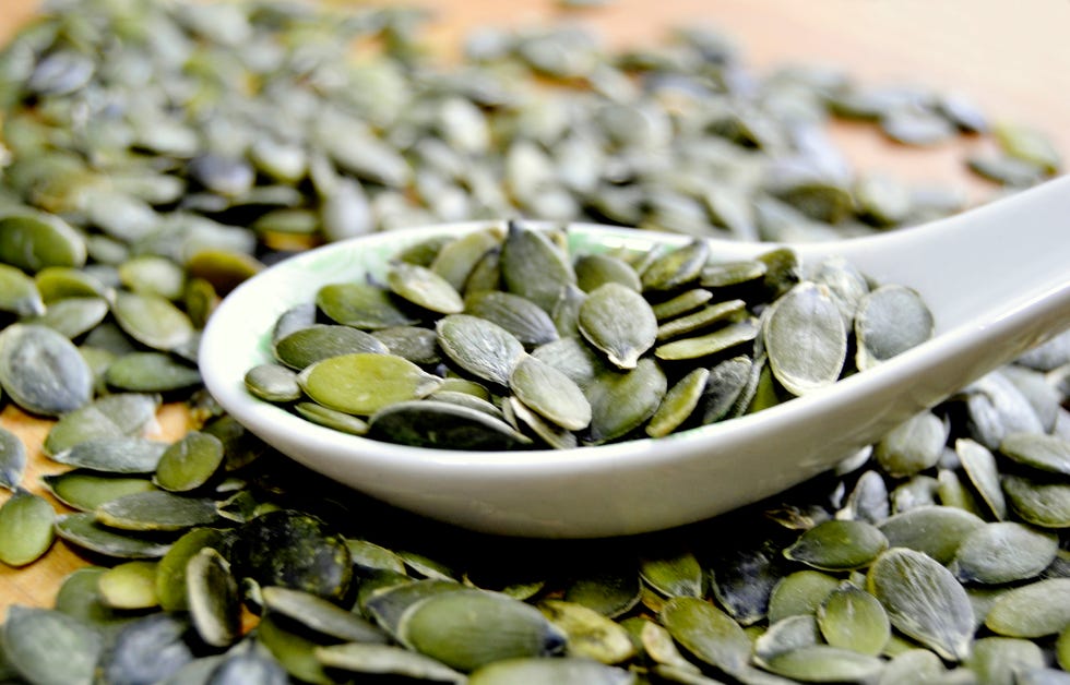 pumpkin seeds on a spoon