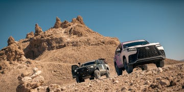 two cars parked on a rocky hill