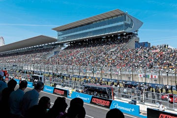 a large crowd of people at a race track