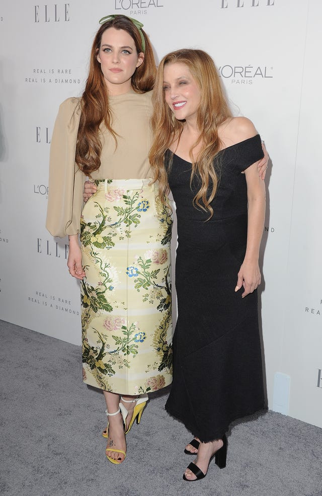 lisa marie presley smiling as she embraces daughter riley keough for a photo