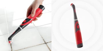 using rubbermaid scrubber to clean grout on white tile