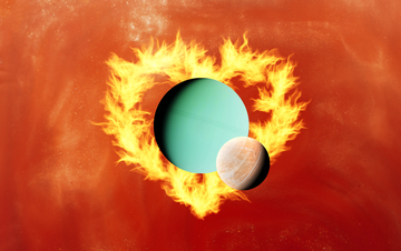 two planets side by side surrounded by a flame heart