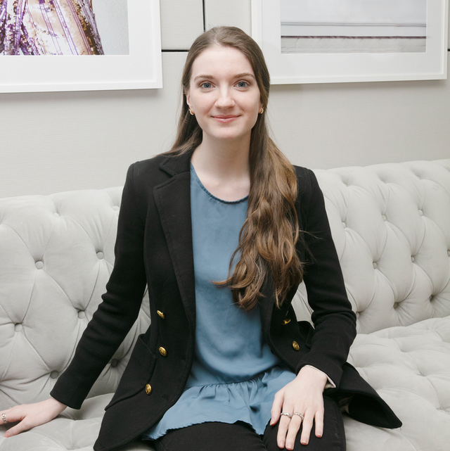 a woman sitting on a couch