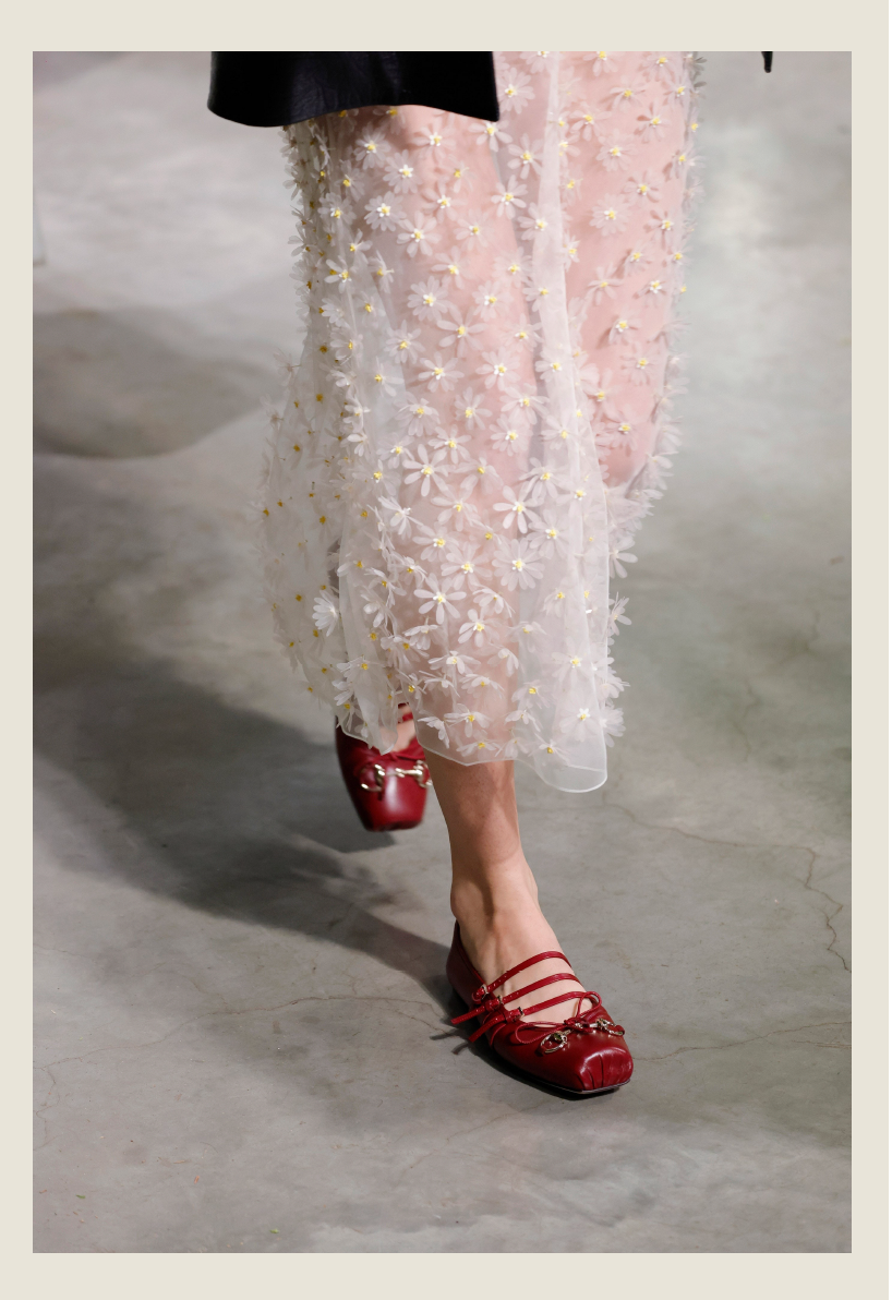 fashion outfit showcasing floral embroidery and red shoes