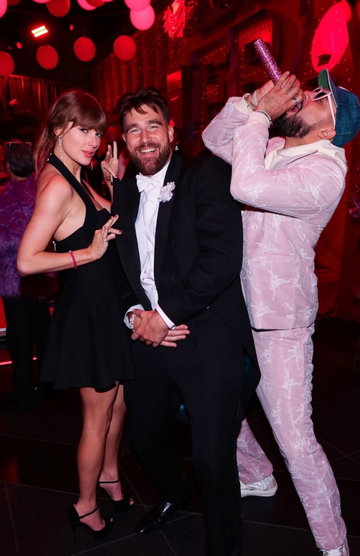 group of people posing at a festive event