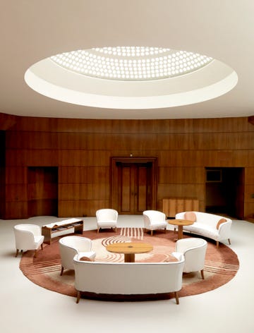 entrance hall of eltham palace, greenwich, london, 2008 light filters down from the glass domed roof illuminating the entrance hall eltham was a royal palace, but by the early 20th century it was partly ruined in the 1930s the courtauld family used the architects seely  paget to restore and extend the historic buildings to create a family home the entrance hall was designed by swedish designer rolf engstromer artist historic england staff photographer photo english heritageheritage imagesgetty images