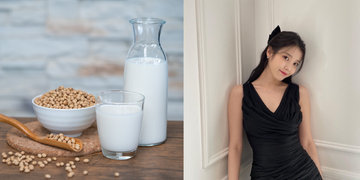 a woman sitting at a table with a glass of milk and a bowl of cereal