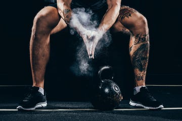 sportsman applying talcum to hands