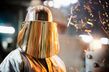 steel worker in protective headwear