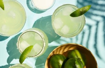 two margaritas on the rocks on a table