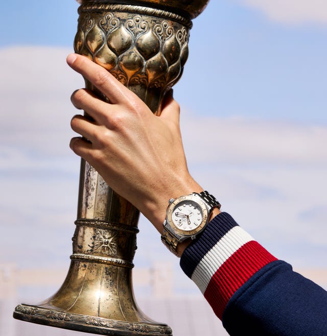 a hand holding a trophy