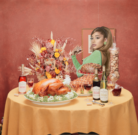 ariana grande sitting at a thanksgiving dinner table