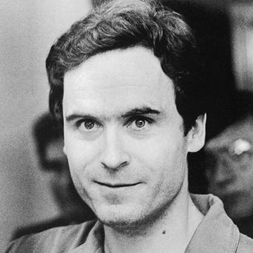 ted bundy looks at the camera with a slight smile