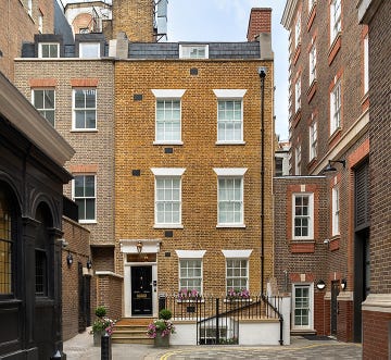 a brick building with a black door