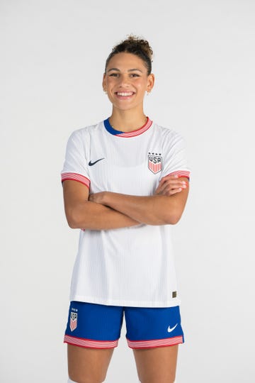 trinity rodman standing with her arms crossed and smiling for her uswnt portrait photo