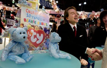 beanie babies founder ty warner warner shaking the hand of a visitor at a toy expo