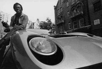 book cover use of this asset requires approval please contact your account representative mandatory credit photo by mark patikycondé nastshutterstock 11820250d musician miles davis sitting on the hood of his lamborghini in a work shirt and long pants miles davis gq december 01, 1970 portrait