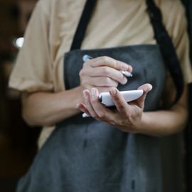 waitress writing on notepad