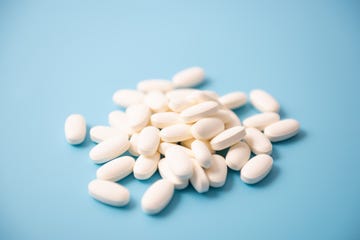 white pills on blue background