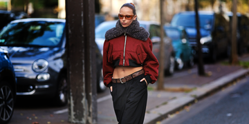 fashionable individual walking along a street