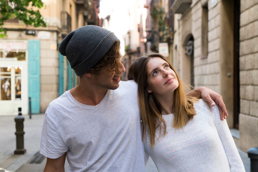 young couple in the city looking around