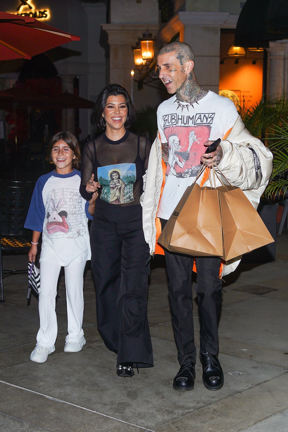 Calabasas, CA  - *EXCLUSIVE*  - Travis Barker is a happy man leaving his new restaurant Crossroads Kitchen opening with his wife, Kourtney Kardashian, and her daughter Penelope Disick.

Pictured: Travis Barker, Kourtney Kardashian

BACKGRID USA 13 OCTOBER 2022 

USA: +1 310 798 9111 / usasales@backgrid.com

UK: +44 208 344 2007 / uksales@backgrid.com

*UK Clients - Pictures Containing Children
Please Pixelate Face Prior To Publication*