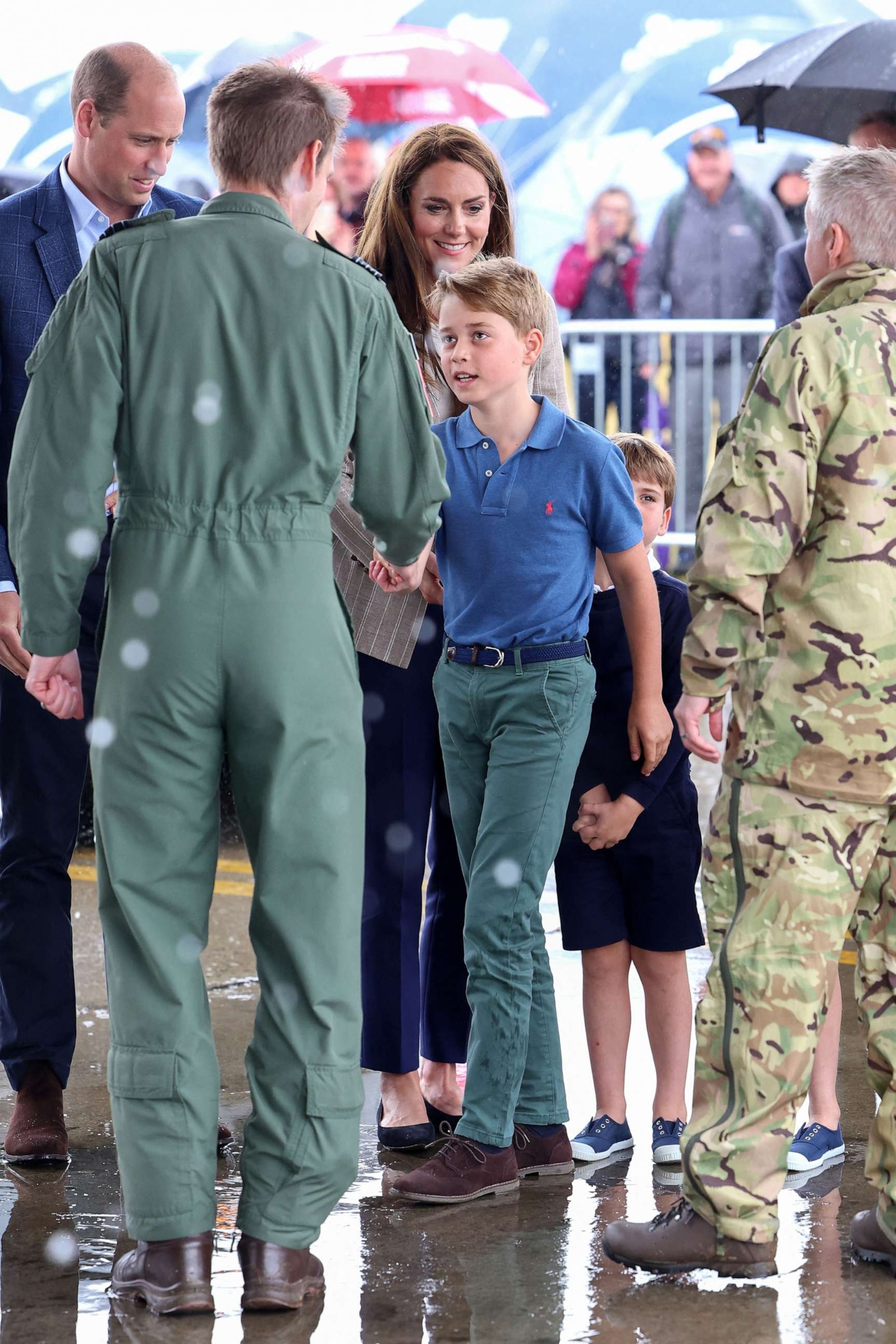 PHOTO: Britain's Prince George of Wales shakes hands as he arrives to visit to the Air Tattoo at RAF Fairford on July 14, 2023, in Fairford, England.