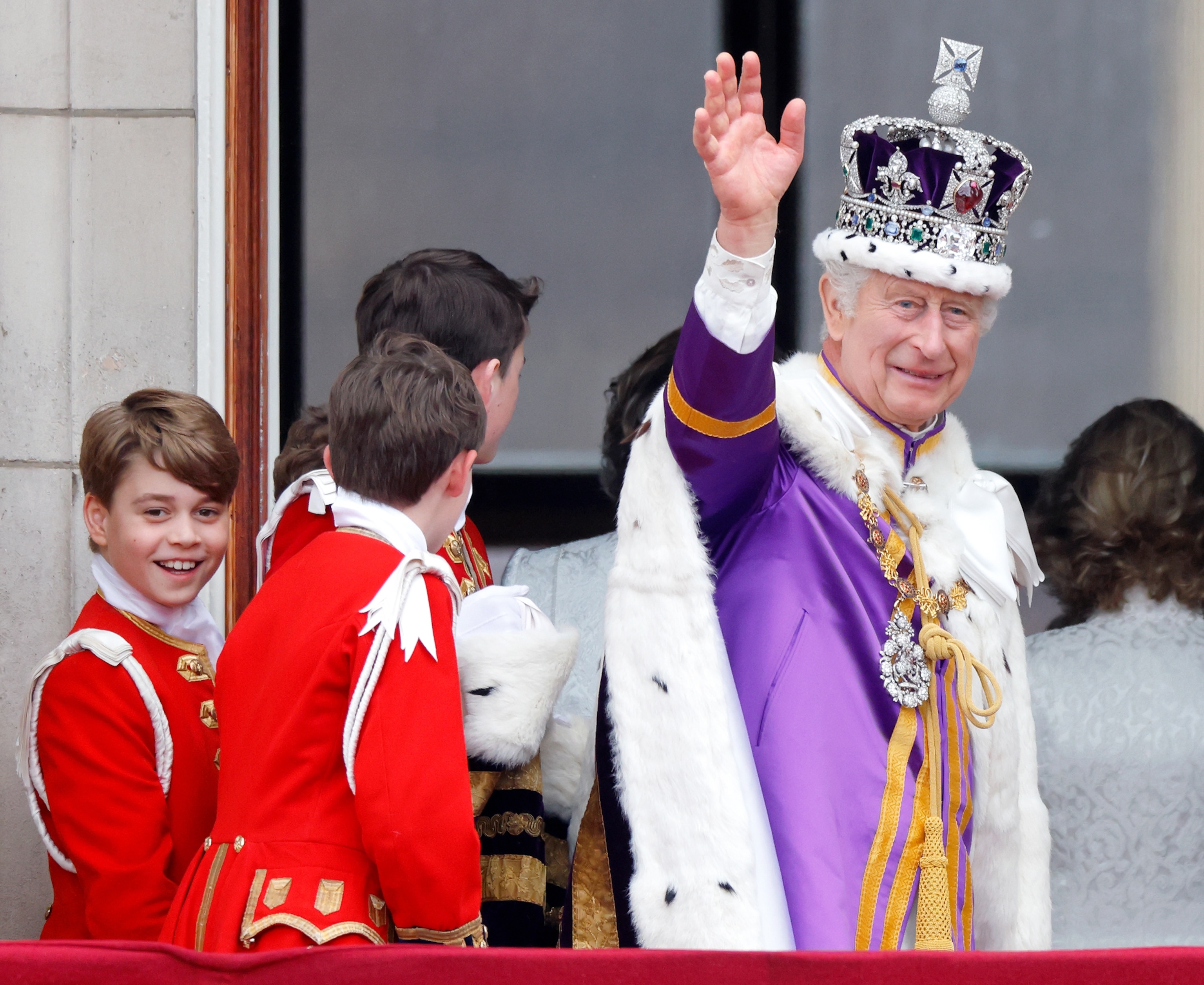 PHOTO: Prince George of Wales (in his role as Page of Honour) and King Charles III watch an RAF flypast from the balcony of Buckingham Palace following the Coronation of King Charles III & Queen Camilla at Westminster Abbey on May 6, 2023, in London.