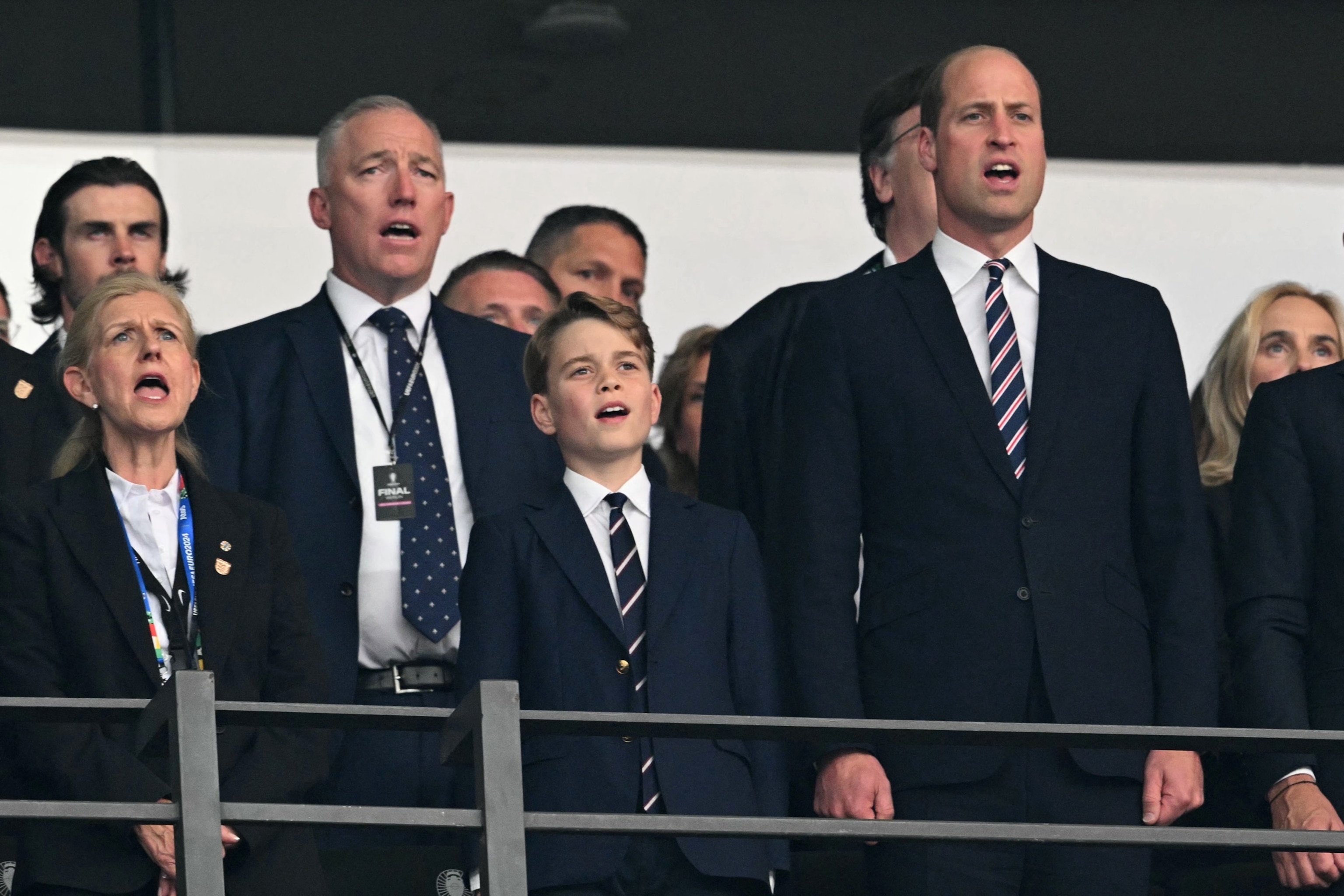 PHOTO: British businesswoman Debbie Hewitt, Britain's Prince George of Wales and Britain's Prince William sing the national anthem ahead of the UEFA Euro 2024 final football match between Spain and England at the Olympiastadion in Berlin on July 14, 2024.