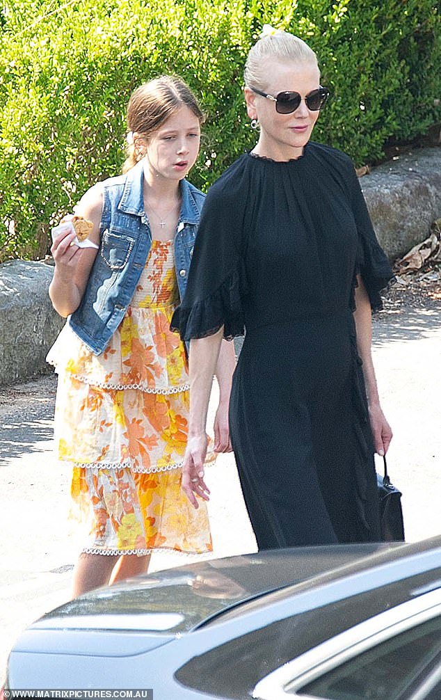 Shining bright: Sunday wore a yellow and orange dress teamed with a denim vest