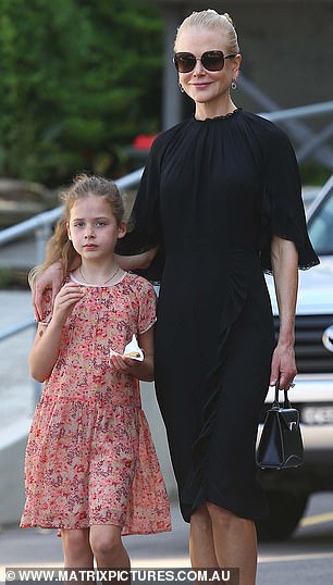 Flower power: The girls looked cute as they strolled with their parents in floral ensembles