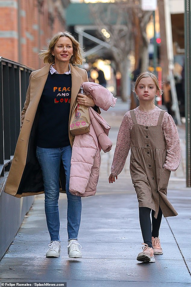 School's out! Naomi looked in high spirits as she strolled down the streets with Kai after the completion of the school day