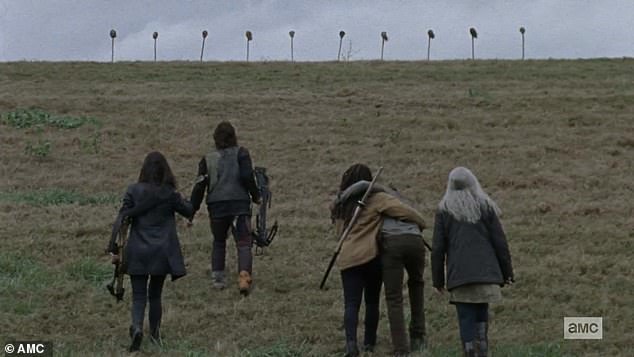 Border marker: Ten spikes with the severed heads of survivors were placed on a ridge with the group breaking down as they began to recognise the faces