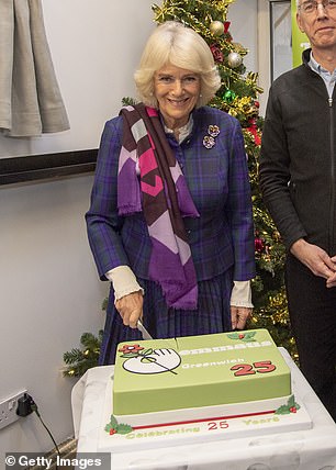 She posed with a bright green cake, featuring Emmaus' logo and was gifted with some beautiful flowers