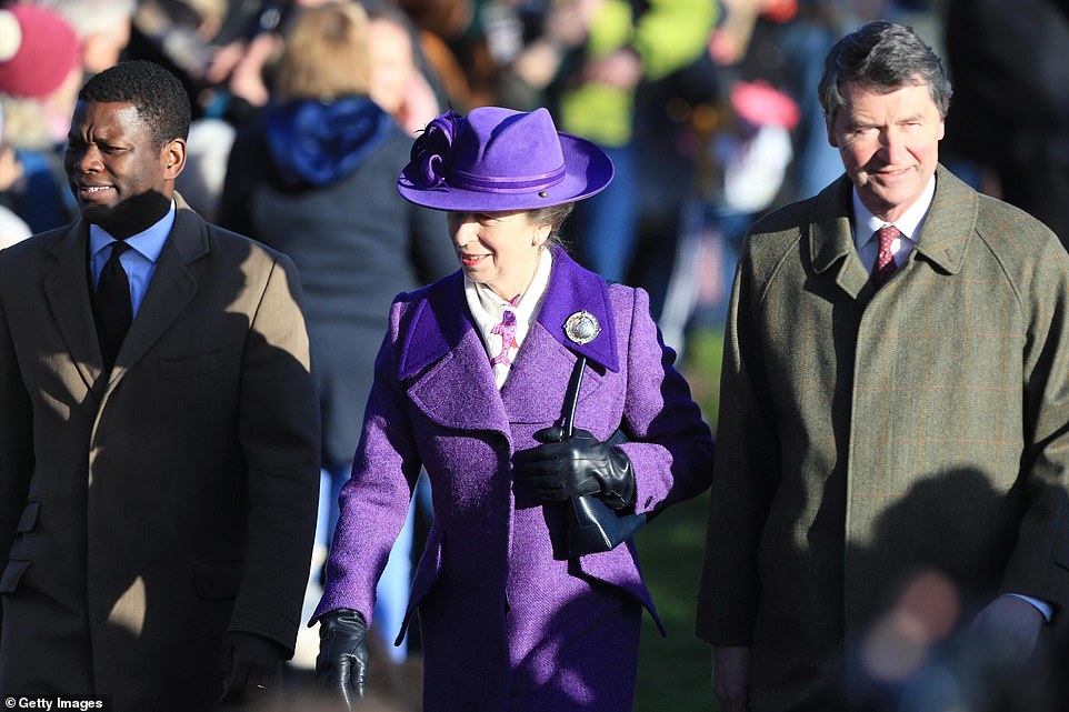 The Princess Royal wore a fetching purple fedora as she walked alongside her husband, Vice Admiral Timothy Laurence