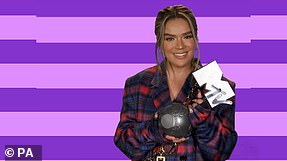 Triumph: Karol G beamed as she picked up the Best Latin award