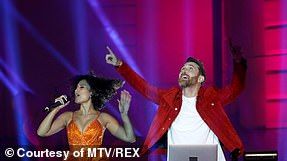 On cloud nine: David Guetta beat out Calvin Klein for the Best Electronic accolade (pictured on stage with Raye)