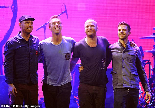 Sad: The frontman dropped the bombshell that he was certain he and his bandmates - Jonny Buckland Will Champion and Guy Berrymawill (L-R) will stop making music after they release their twelfth record (pictured in 2011)